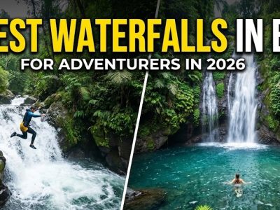 A traveler swimming in the crystal-clear pool beneath the towering Sekumpul Waterfall in the lush Bali jungle.