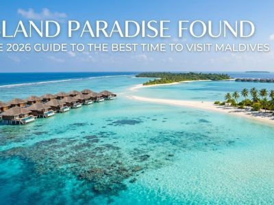 Aerial view of a luxury Maldivian resort over crystal clear turquoise waters and white sand beaches.