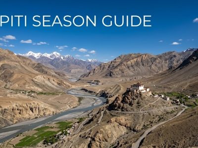 A breathtaking view of an ancient Buddhist monastery sitting atop a rugged mountain in the Spiti Valley desert landscape.