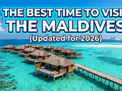 A picturesque overwater bungalow in the Maldives surrounded by crystal clear turquoise water under a sunny blue sky