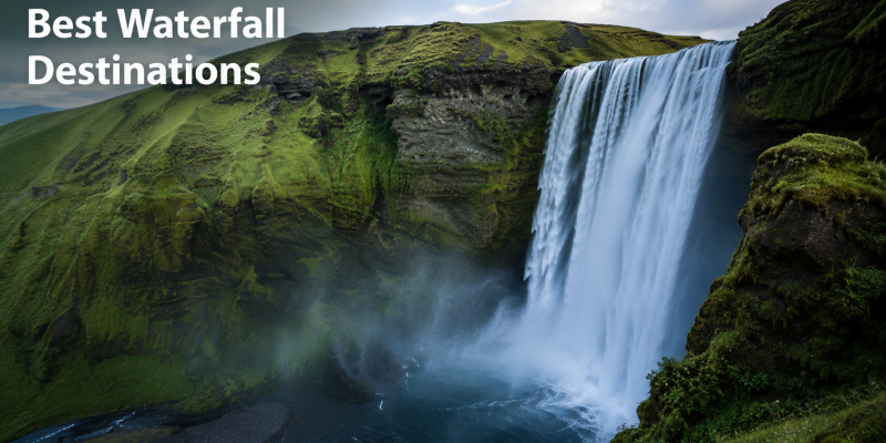 A panoramic landscape shot of a massive, multi-tiered tropical waterfall system surrounded by lush green rainforests under a bright sky.