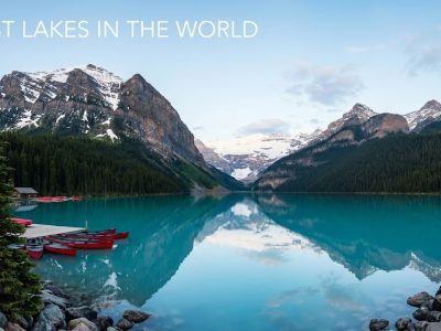 landscape of a pristine blue lake surrounded by mountains, featuring