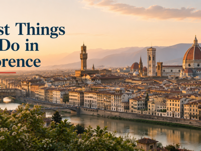 A panoramic sunset view of the Florence skyline showcasing the massive red-brick dome of the Duomo rising above historic stone buildings by the Arno River.